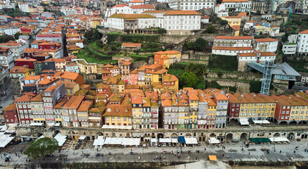 Fototapeta na wymiar Porto, Portugal - 12.25.2022: Aerial view of the old city of Porto. Portugal old town ribeira aerial promenade view with colorful houses. High quality photo
