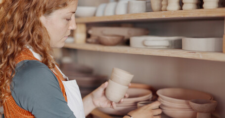 Pottery, woman artist and shelf for ceramic cups for shop, check quality for creative class or...