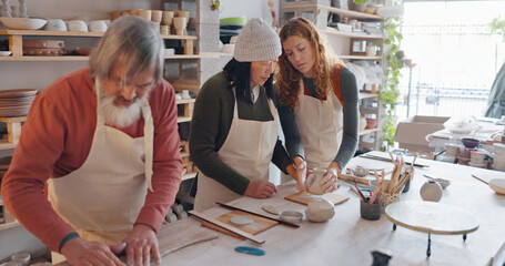 Creative pottery class, senior couple and teacher working together. Art, creativity and education, retirement hobby with clay for asian man and woman from Japan in workshop with girl teaching craft.