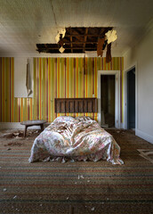 An abandoned 1970s bedroom in a hotel