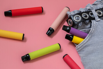 Colorful disposable vapor stick on a light background. Concept of modern e-smoking, vaping and...
