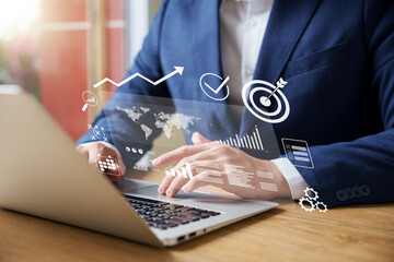 Businessman analyzing company's financial balance sheet working with digital augmented reality...