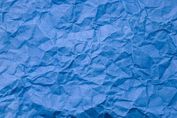 Abstract blue paper wrinkled or crumpled texture background , top view , flat lay.