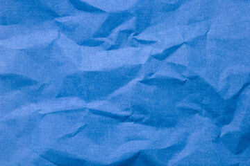 Abstract blue paper wrinkled or crumpled texture background , top view , flat lay.