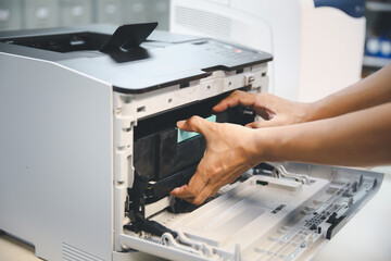 Technician hand open cover printer photocopier or photocopy to replace ink cartridges or fix paper...