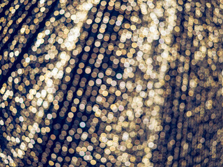 Many small defocused bokeh natural lights texture background.