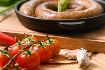 Roasted homemade sausage in a cast-iron frying pan