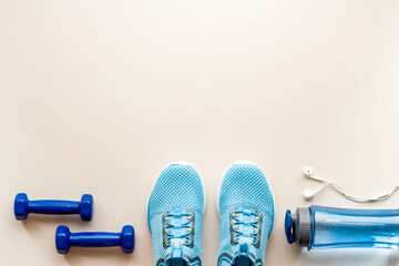 Sneakers and bottle shaker - workout flatlay, top view