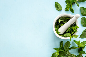 Aroma herbs for medicine and cooking. Mint leaves in mortar