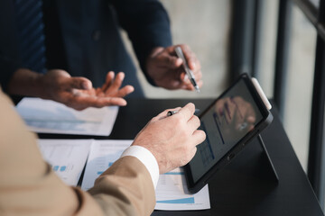 The sales department is having a monthly summary meeting to bring it to the department manager, they are verifying the correctness of the documents that are prepared before bringing in to the manager