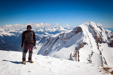 Fototapeta na wymiar Snow hiker at the top of a mountain In the background you can see the Monte Perdido mountain