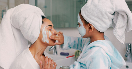 Family, facial and mask with mother in bathroom with young child using hand to apply cosmetics....