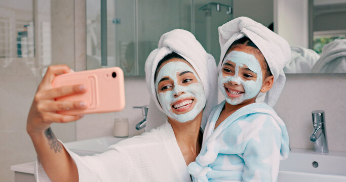 Selfie, facial and family with a mother and daughter in the bathroom of their home together. Children, love and photograph with a woman and girl kid posing for a picture while bonding in the house