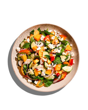 Isolated Summer Peach And Cheese Salad With Mint, Top View