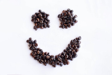 Coffee beans in the form of smile on a white background