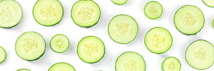 Fresh cucumber slices panorama. Vegetable panoramic banner on white. Eating raw food panoramic banner