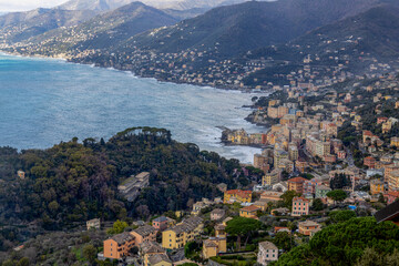 Fototapeta na wymiar Aerial view of the town of Camogli with the rough sea, Genoa province, Italy