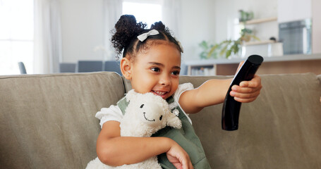Relax, toy and girl watch television with remote for chill leisure time alone in home on sofa. Tv...