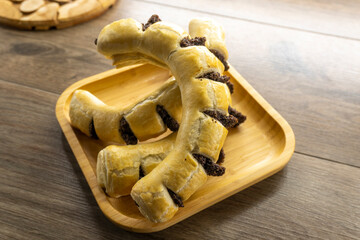 Puff pastry poppy seeds filling on wooden background.food concept. bakery. diet