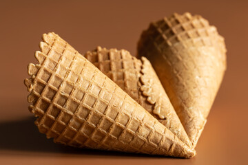 Close-up of waffle cones, creative macro concept of sweets and food.