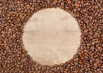 Coffee beans background with round wood center suitable for text