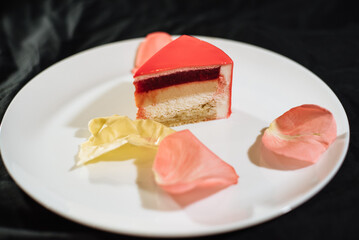 Berry mousse cake with mirror glaze. French fashion cake. Strawberry cake in section.