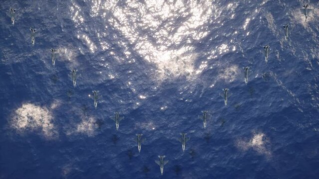 An aerial view over unbranded military fighter jets flying in formation as they execute a low-altitude reconnaissance mission above the ocean waves.