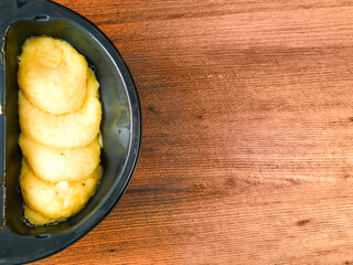 Mashed potato side of a ready meal for microwave on a wooden table. Premium fast food with high quality ingredient.