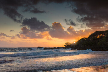 Naklejka na ściany i meble Beautiful colorful sunset on a tropical paradise beach. Carribean island.