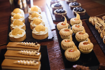 Pastry shop display window with a variety of cakes.