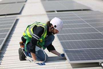 Maintenance engineer, Solar energy systems engineer perform analysis solar panels, Engineer service check installation solar cell on the roof of factory. 