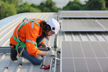 Fototapeta premium Technology solar cell, Engineer service check installation solar cell on the roof of factory. technician checks the maintenance of the solar panels