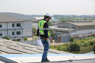 Technology solar cell, Engineer service check installation solar cell on the roof of factory. technician checks the maintenance of the solar panels