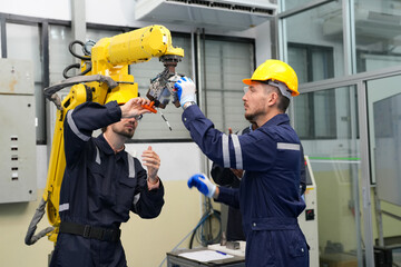 Analyzing Machine Failures in a Production Process. Robotics research and development team having a...