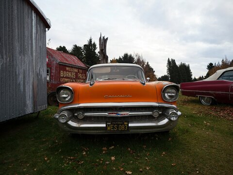 Burkes Pass, New Zealand - 2023: Old vintage retro orange Chevrolet classic car in Burkes Pass Village outdoor museum