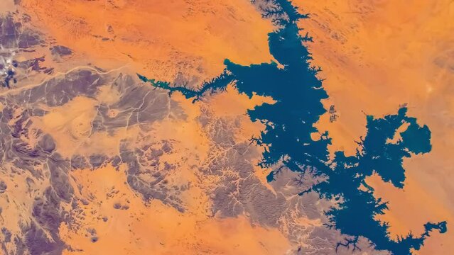Satellite view of Aswan Dam, Lake Nasser and Nile River in Egypt. Elements of this video furnished by NASA.