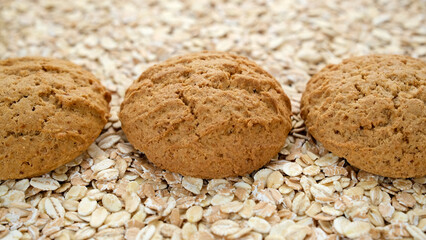 Oatmeal cookies and raw oatmeal flakes