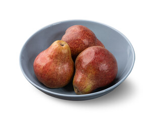 Red pears in a bowl isolated over white background