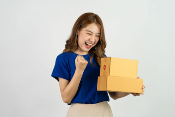 Asian woman smiling happily holding parcel box isolated on white background Delivery and express shopping online. Business concept sme.