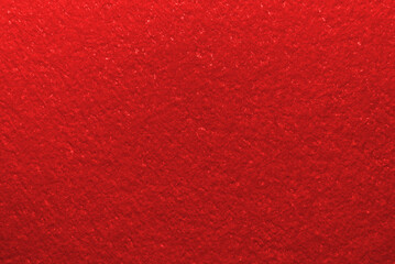 Red color cardboard texture as background

