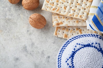 Passover celebration concept. Matzah, red kosher and walnut. Traditional ritual Jewish bread...
