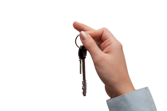 Hand holds house keys. concept of buying or selling home