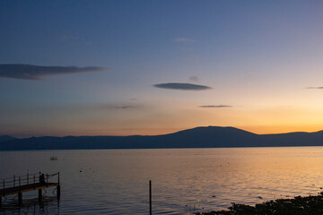 Dock in a lake at dusk