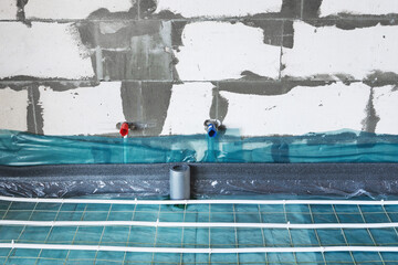 Heating and water pipes installation on construction site