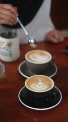 latte art on the wood table in the coffee shop