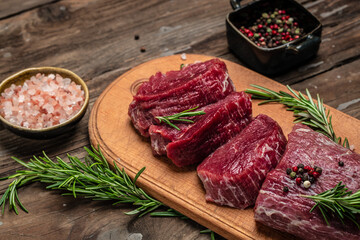 Beef Tenderloin fillet with rosemary and spices. Preparing fresh beef steak ready to cook, banner, menu, recipe place for text, top view
