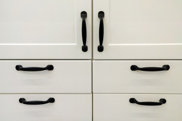 White cabinet doors with black handles