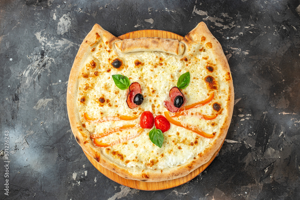 Wall mural children's pizza in the shape of a cat's face on a dark background, banner, menu, recipe place for t