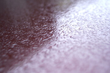 water drops on a painted metal surface