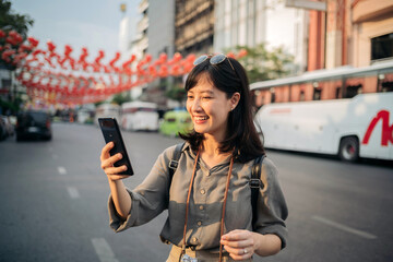 Fototapeta premium Young Asian woman backpack traveler enjoying China town street food market in Bangkok, Thailand. 